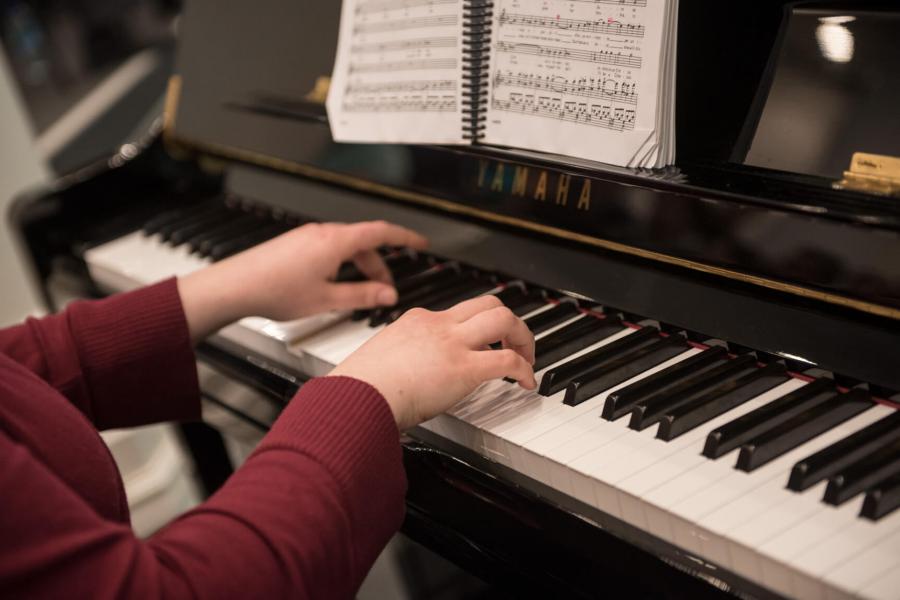 A person plays the piano. 