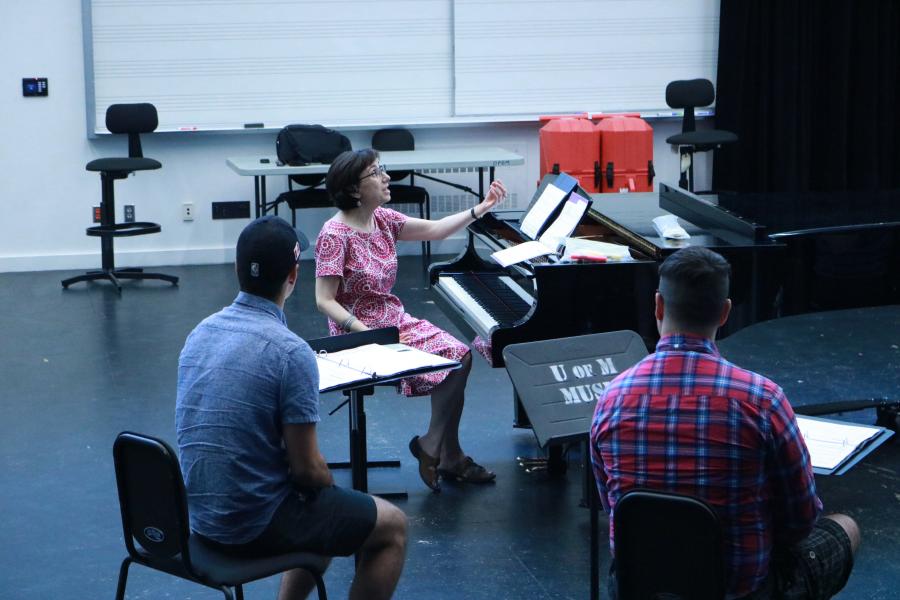 Opera Studies Coordinator Katherine Twaddle coaches students for the 2019 Manitoba premiere of dawn always begins in the bones.