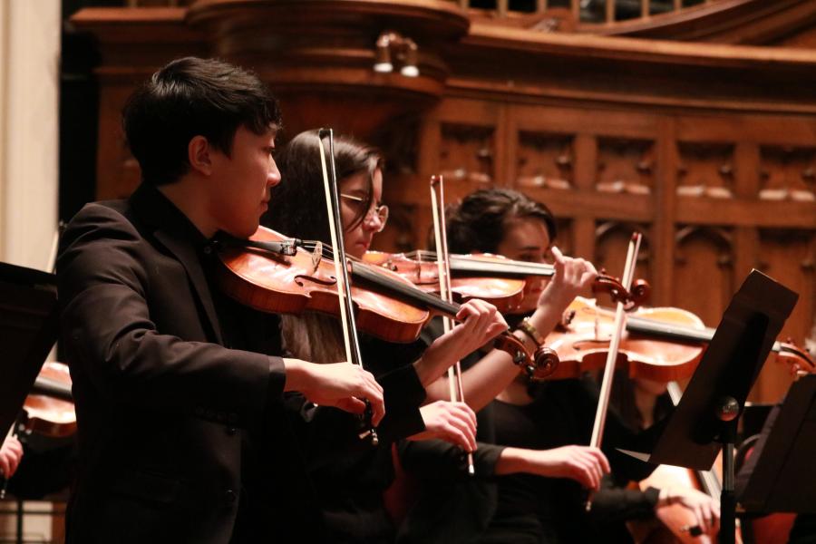 Violinists perform with the University of Manitoba Symphony Orchestra