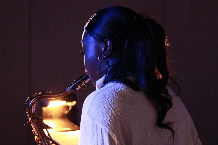 A student saxophonist performs at a jazz ensembles concert