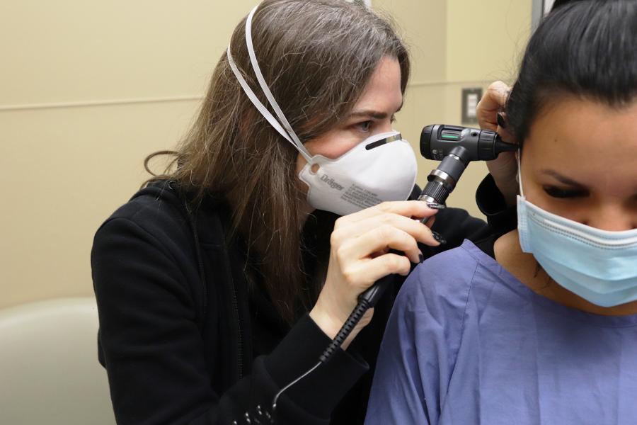 Physician examining a patient.