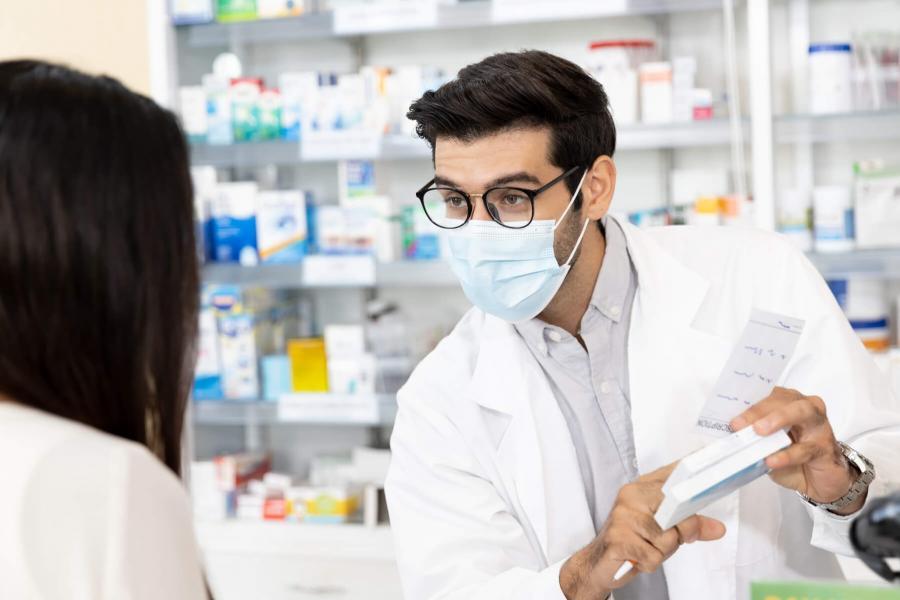 Pharmacist talking to a patient.