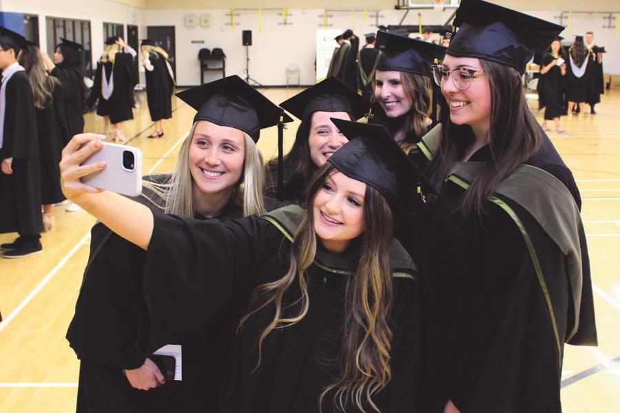 Group of new graduates in robes.