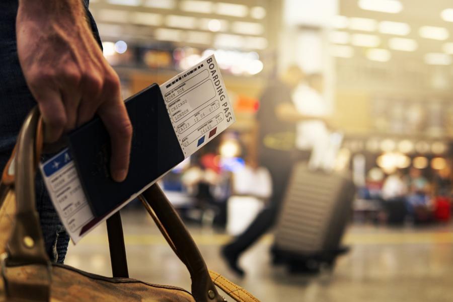 hand with a boarding pass.