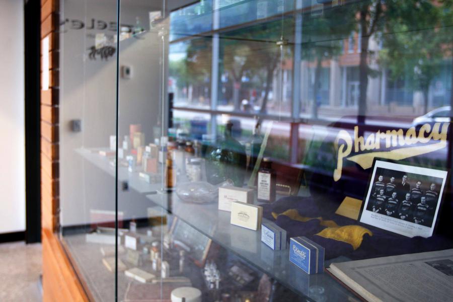 A close up view of a historical pharmacy display case outside Steele's Apothecary.