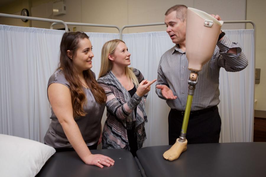 Students learn about a prosthetic leg