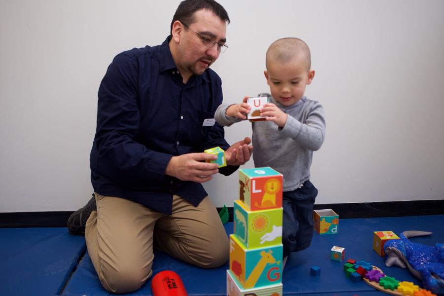 Therapist working with a child patient.