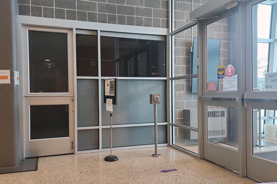 Entrance to room 119 on campus