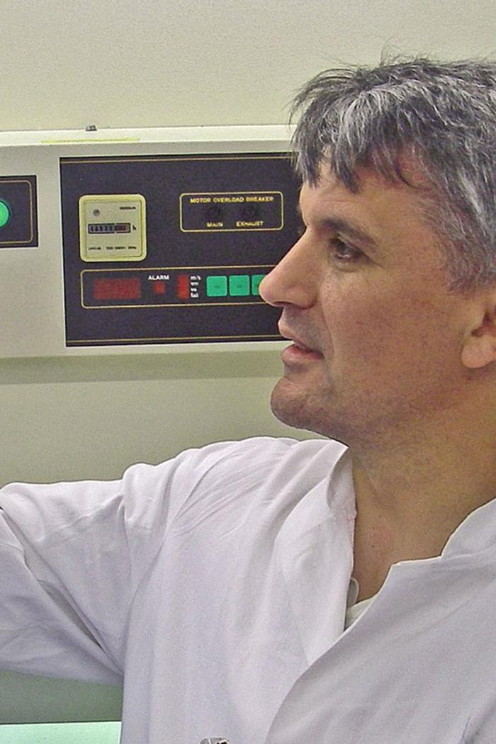 Nad Budisa wearing a lab coat and working with lab equipments.