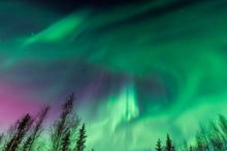 the northern lights with green and purple hue