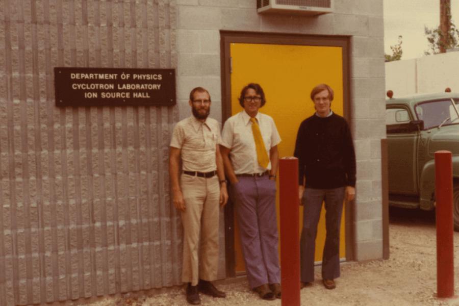 Group of people in front of the department of physics cyclotron entrance.
