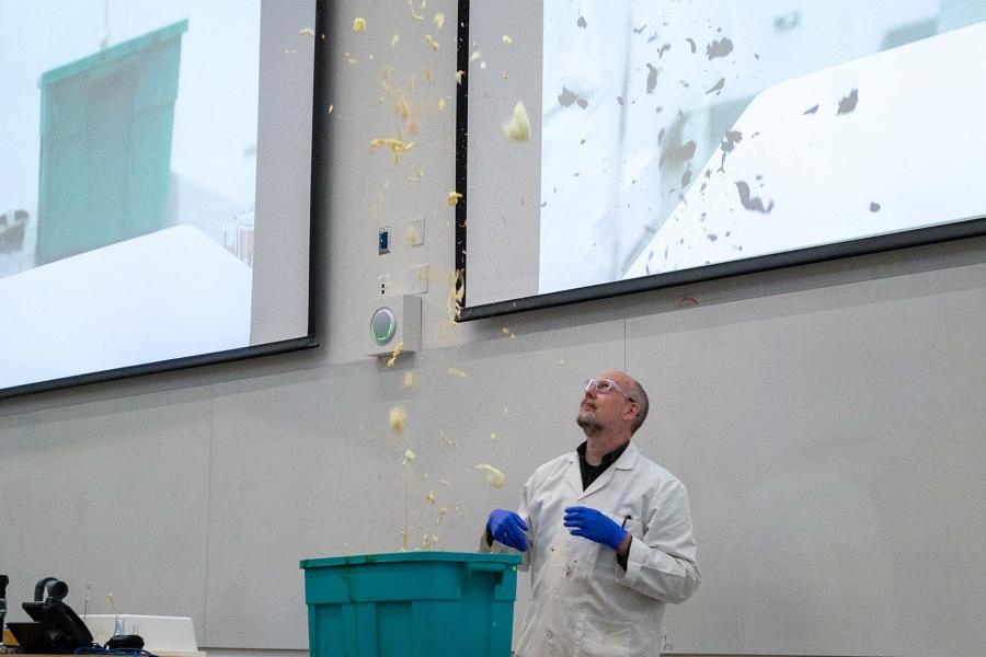 A scientist demonstrating a chemistry experiment.
