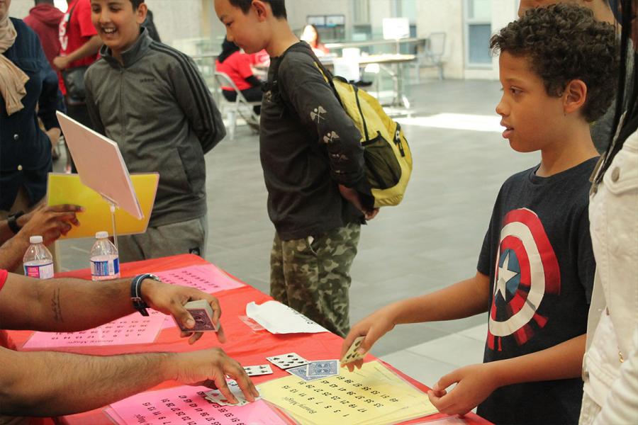 A little kid playing math games.