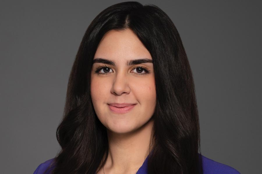 Mina smiling at the camera.