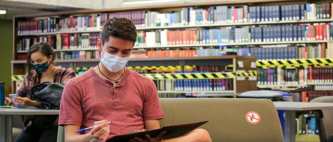 Students socially distancing on campus wearing masks