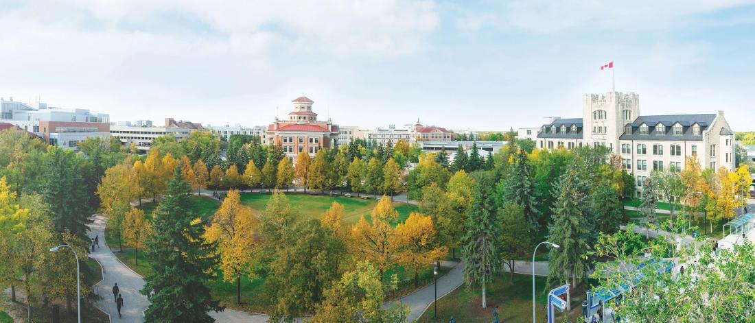 The Administration and Tier buildings shown with trees with Fall colours.