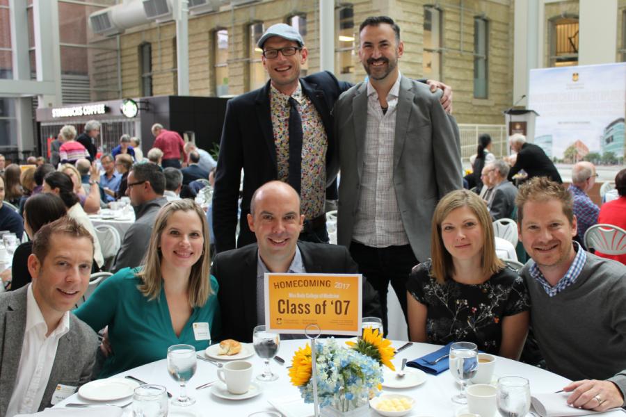 A group of 7 University of Manitoba Alumni at a class reunion.