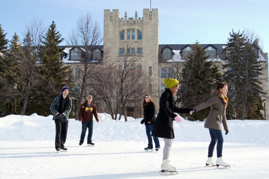 A group of International University of Manitoba students try outdoor ice skating on campus.