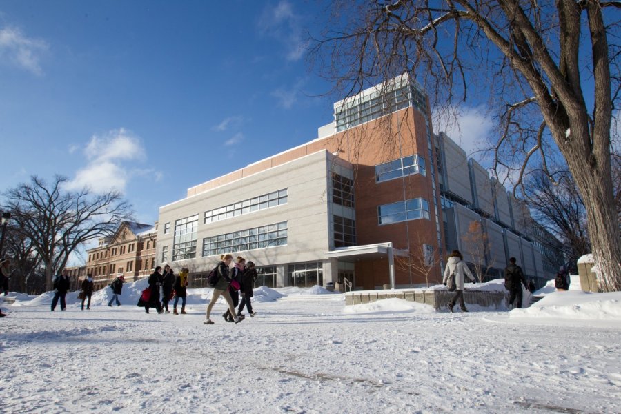 Students walk on campus in winter.