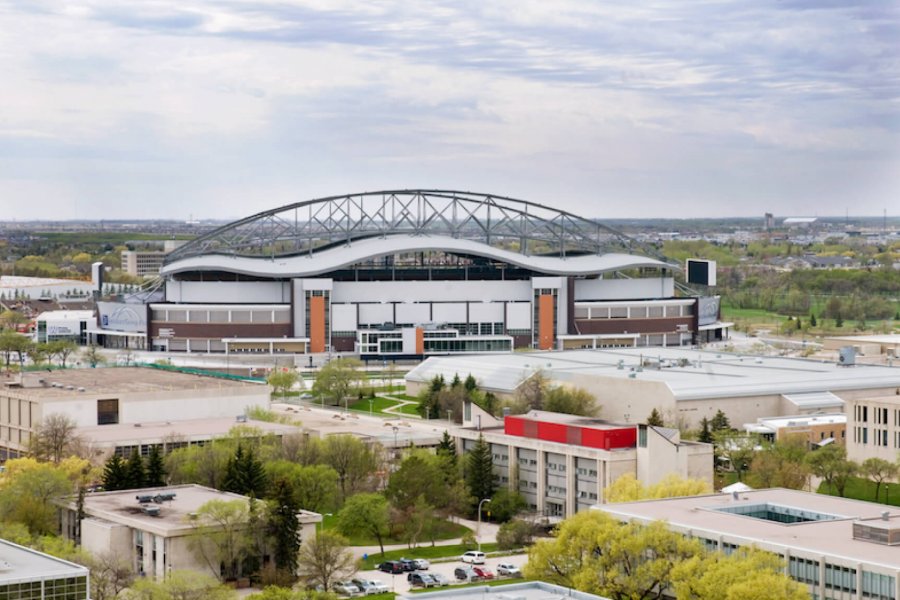 An aerial view of the University of Manitoba that shows several buildings and Investors Group Field.
