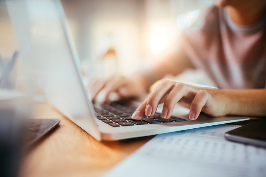 hands on a laptop