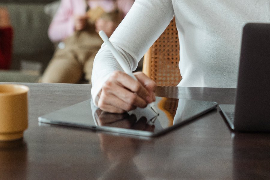 Woman using laptop and tablet