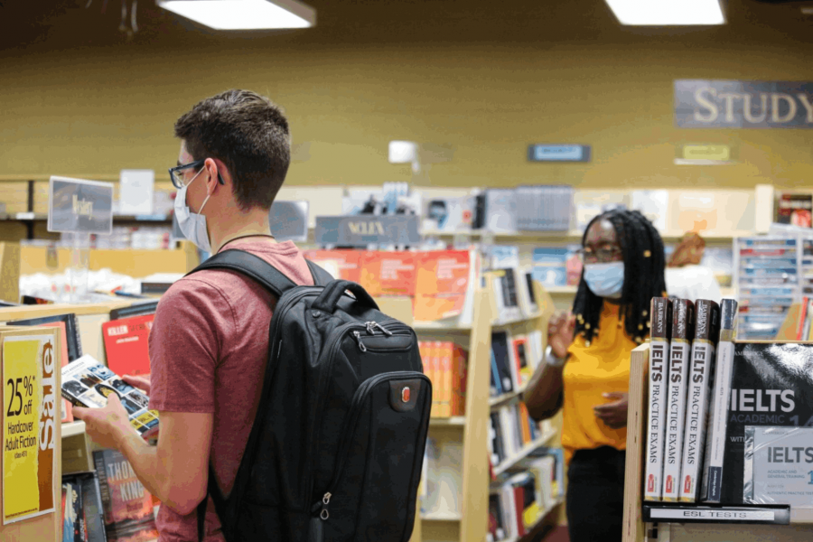 Students wearing personal protective masks in the Bookstore.