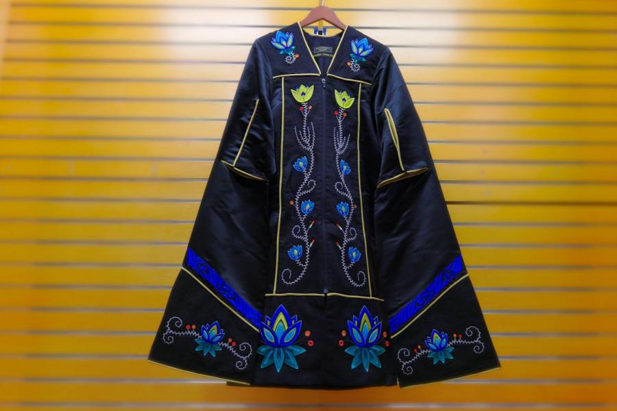 A black grad gown with blue and yellow beaded crocuses.