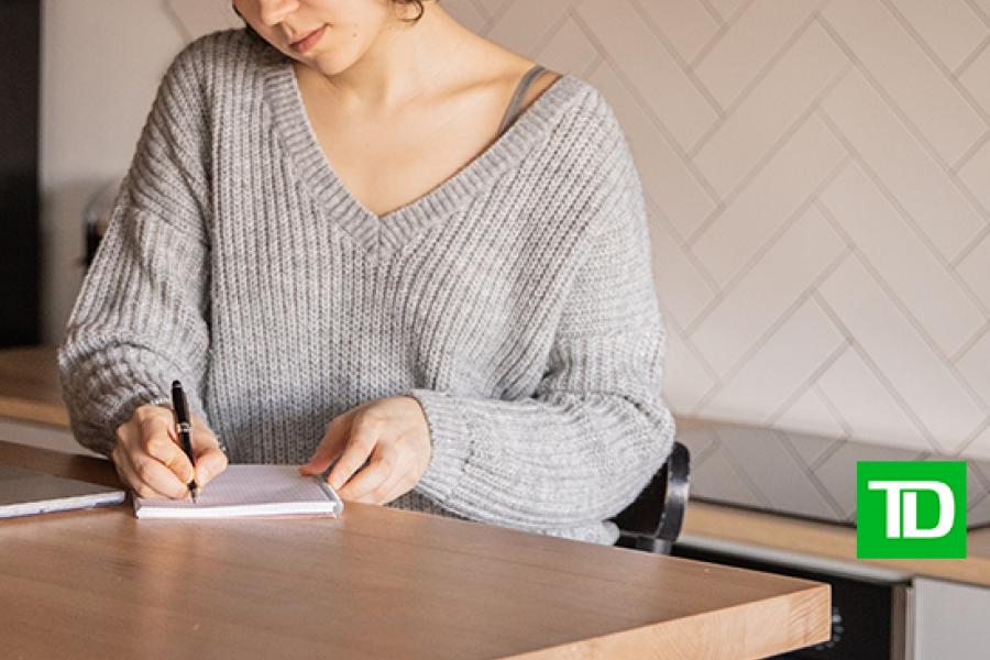 woman sitting at desk financial planning