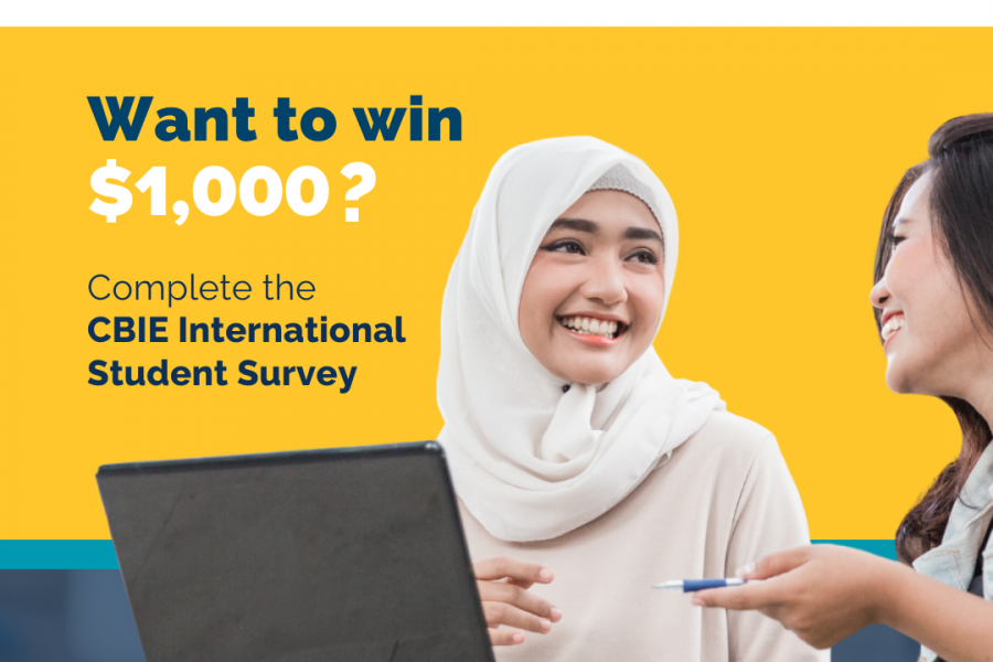Complete the CBIE International Student Survey. Image of student with laptop.