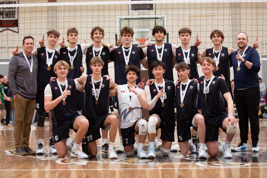 The Winstrike 18U boys team poses with their gold medals after winning the Central Showdown volleyball tournament at UM in March 2026.