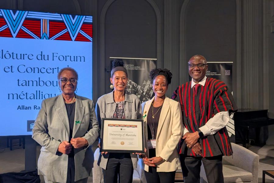 Four individuals stand with a certificate at Scarborough Charter Forum 2026