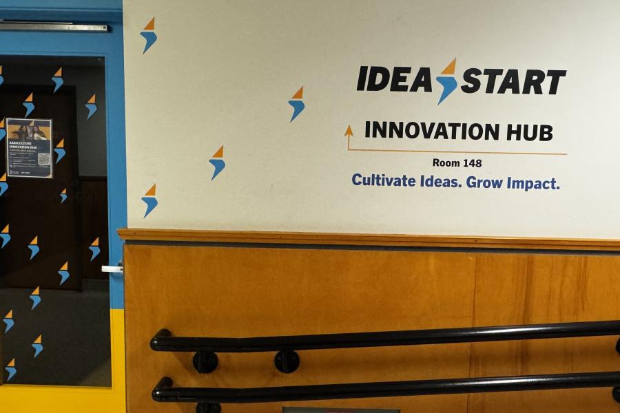 IDEA START Agriculture Innovation Hub entrance at Room 148, featuring blue and yellow branding, the IDEA START logo and the tagline “Cultivate Ideas. Grow Impact.”