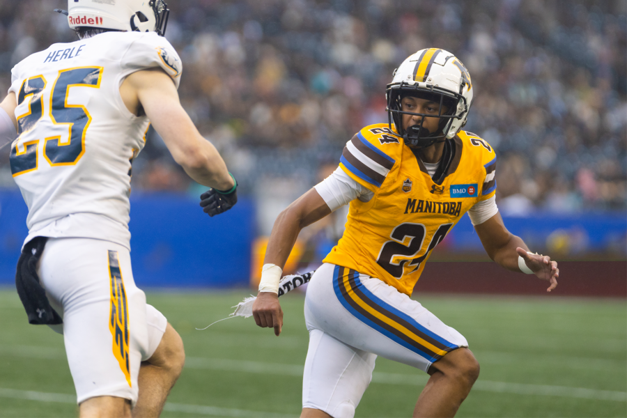 An image of a Bisons football athlete running.