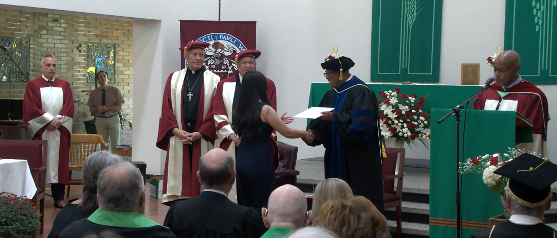 student recieving award opening exercises